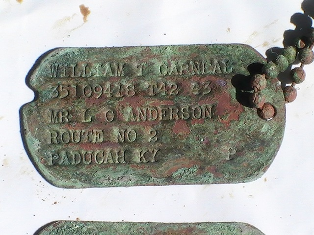 A pair of dog tags of William Carneal.